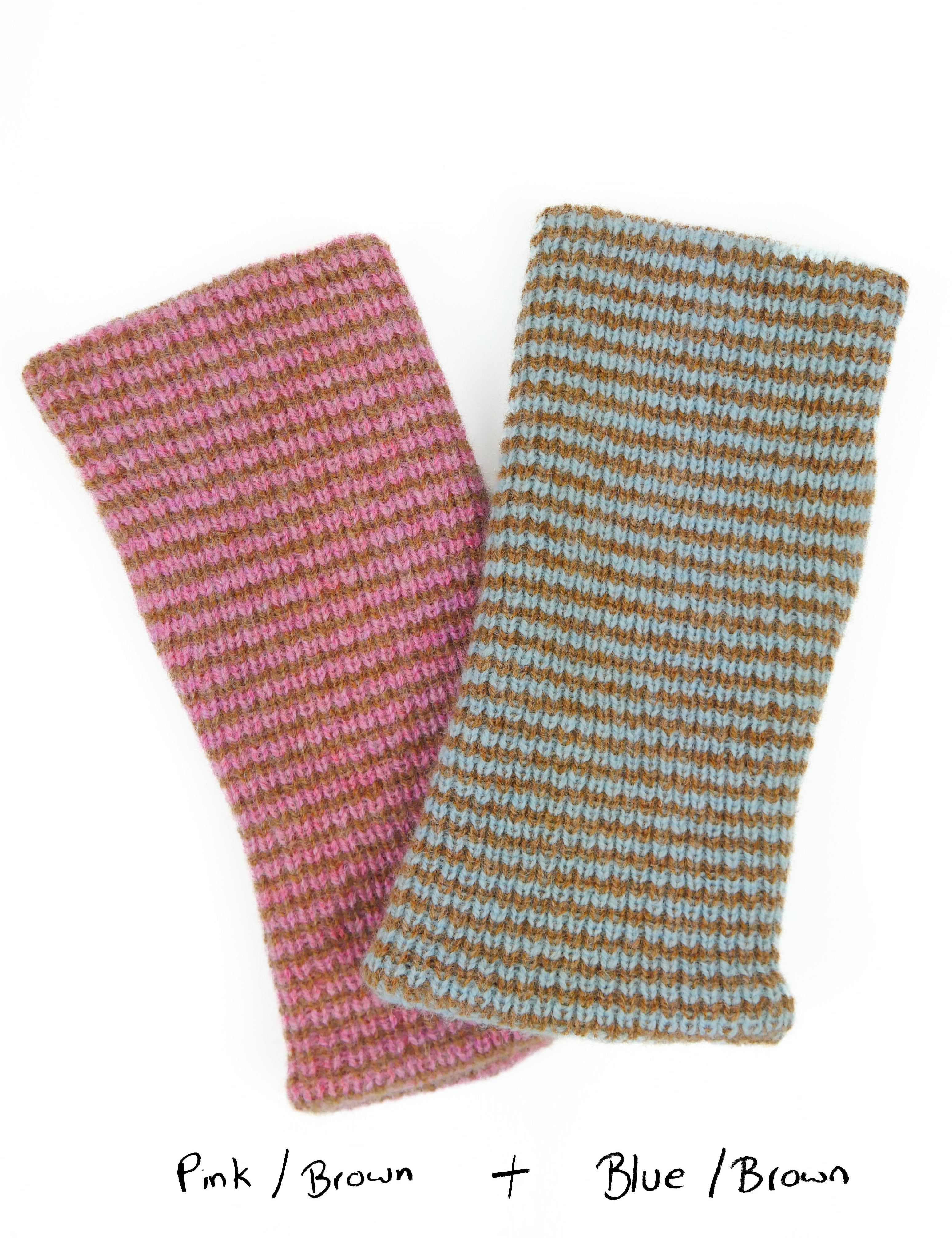 Two knitted wrist warmers, one pink and brown, the other blue and brown, on a white background.