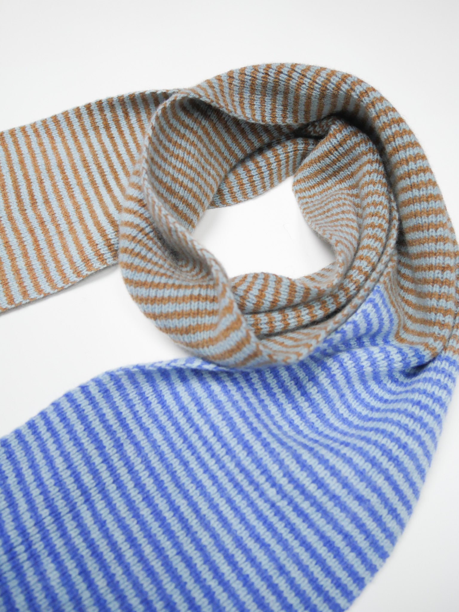 Striped scarf with blue and brown stripes on a white background