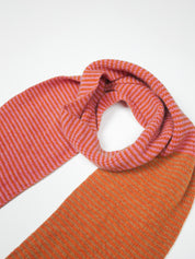 Orange and pink striped scarf on a white background