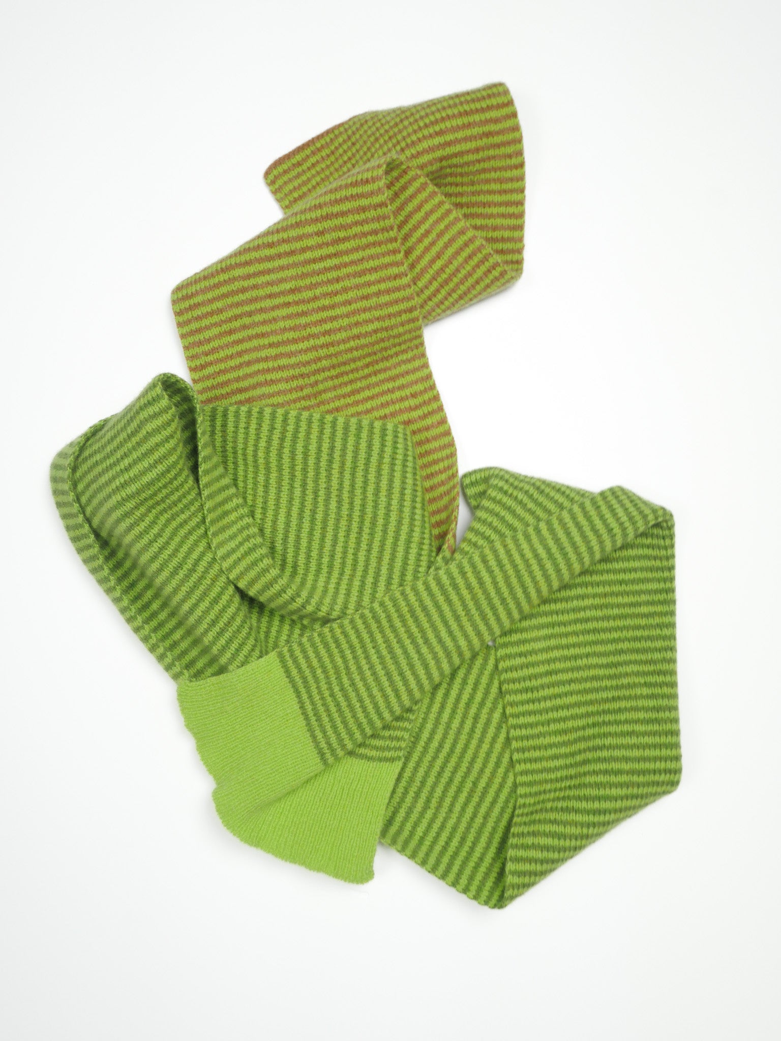 Green striped fabric on a white background